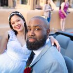 Joyful bride and groom in convertible at wedding day in Albuquerque, New Mexico.